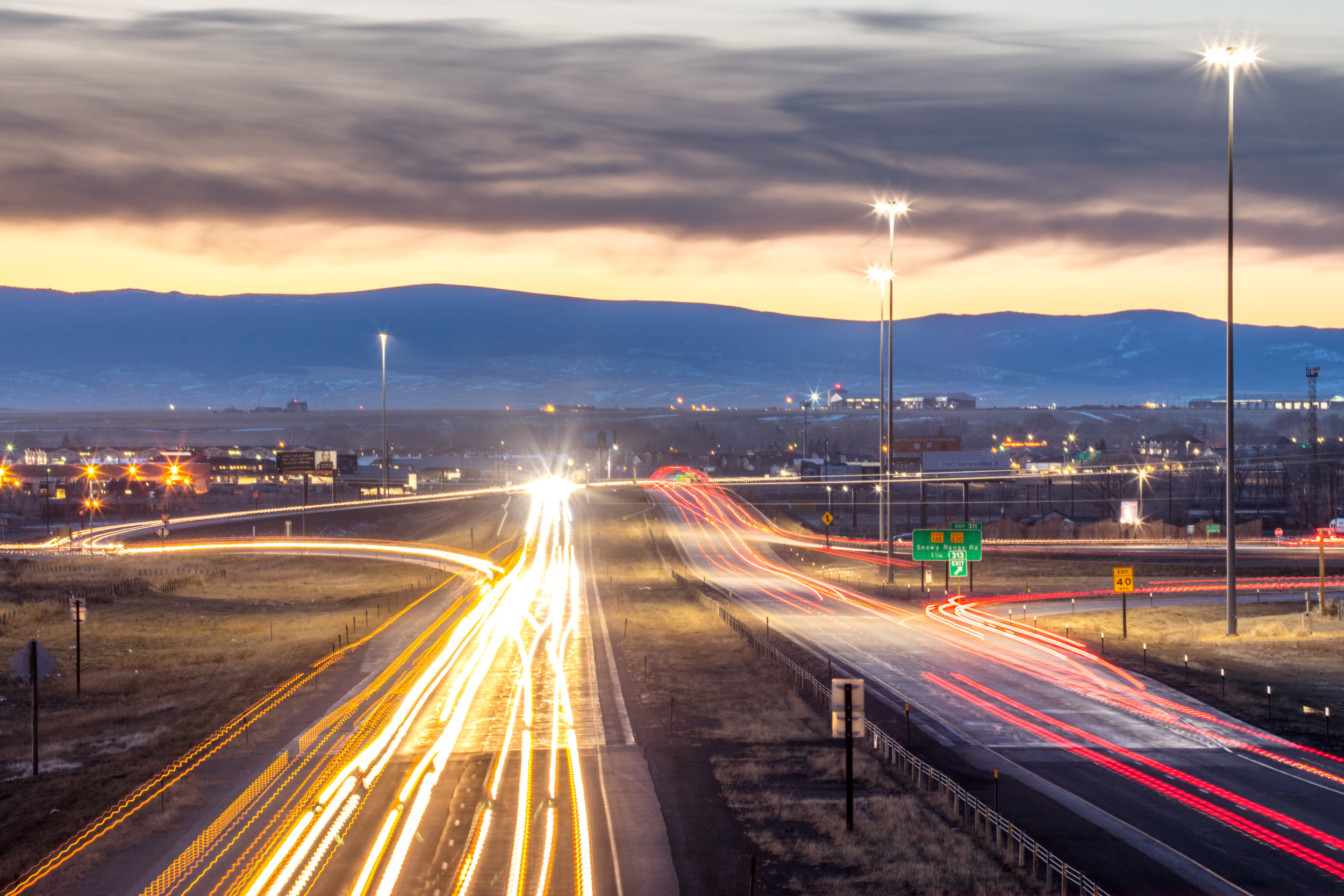 Image of evening traffic on Interstate 80 through Laramie, Wyoming.